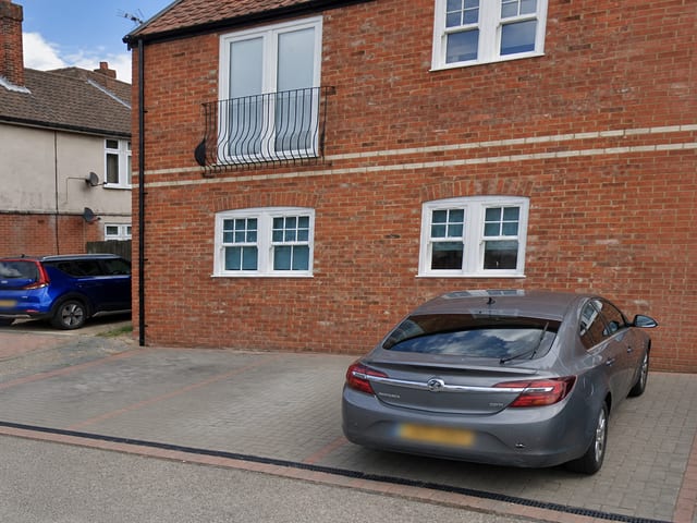 Wide driveway by town